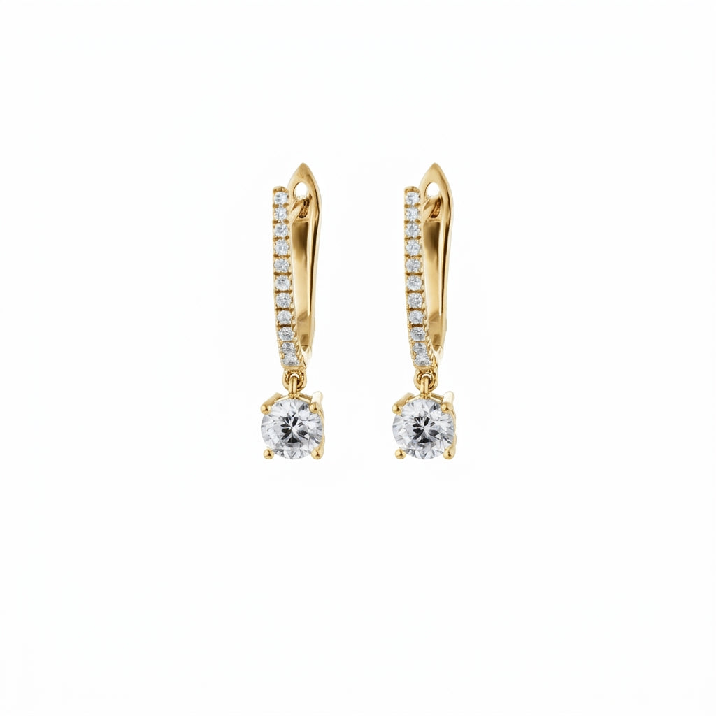 Yellow gold earrings with diamonds on a white background
