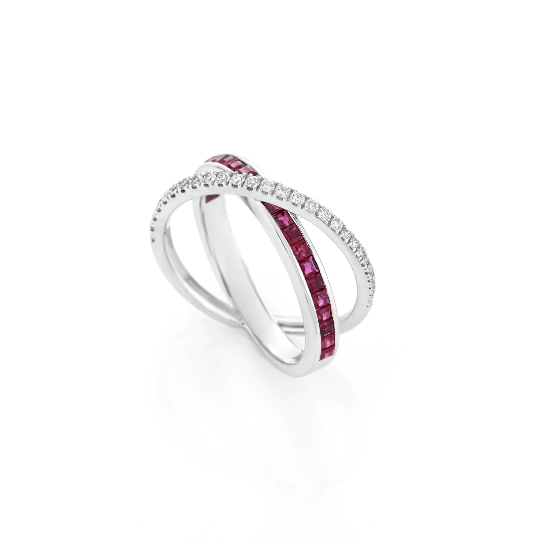 Ruby Criss Cross Ring featuring princess cut rubies and brilliant cut diamonds in white gold.