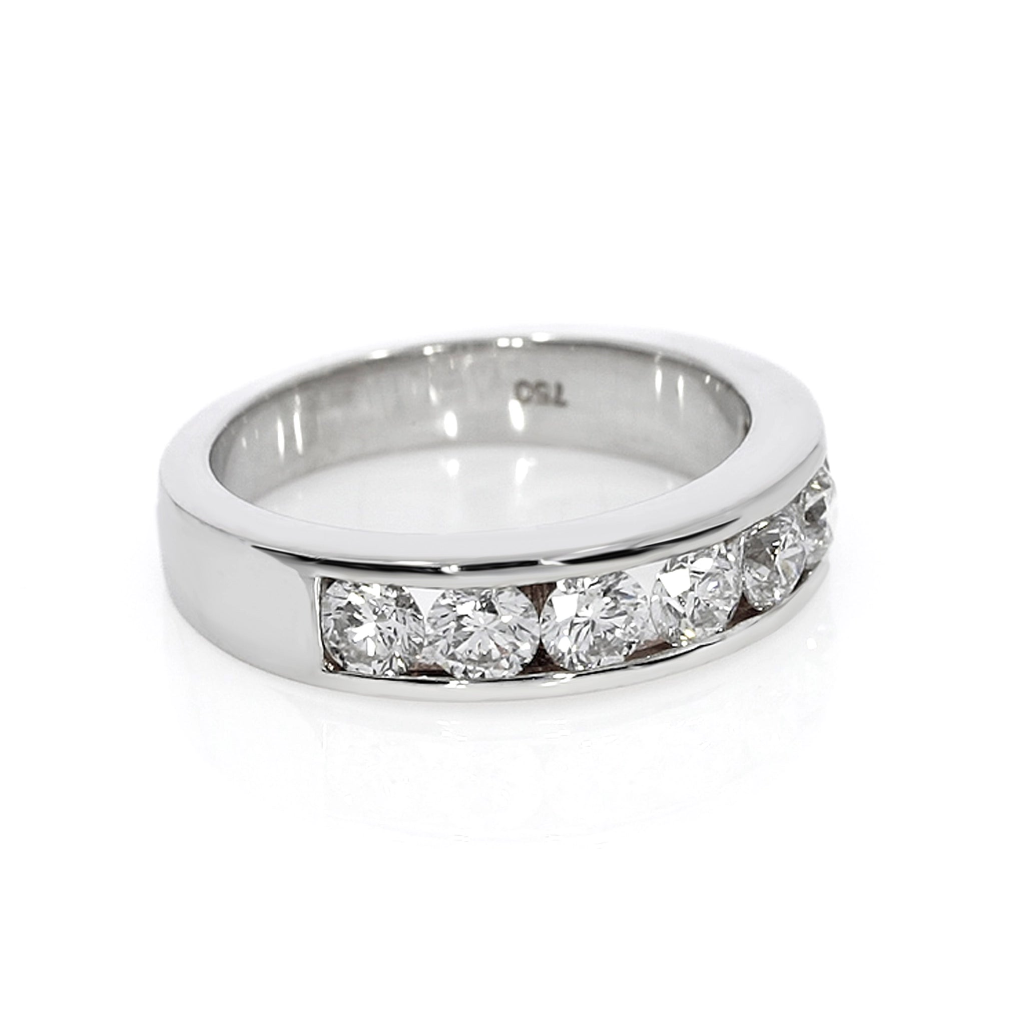 Round channel set diamond ring featuring seven round brilliant diamonds in a sleek modern design.
