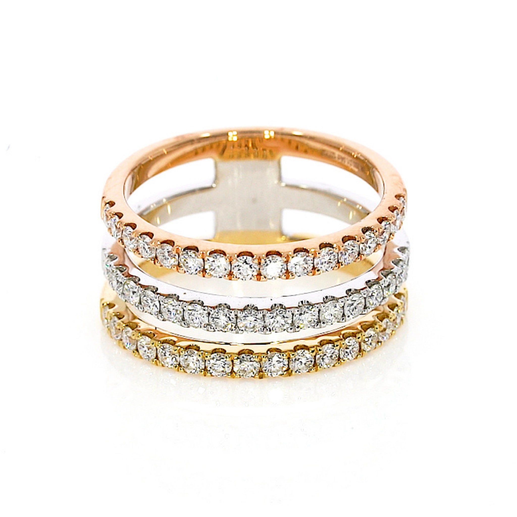 Ultra-modern, timeless three-color gold ring with 1.04cts round brilliant cut diamonds, set in 18ct gold.