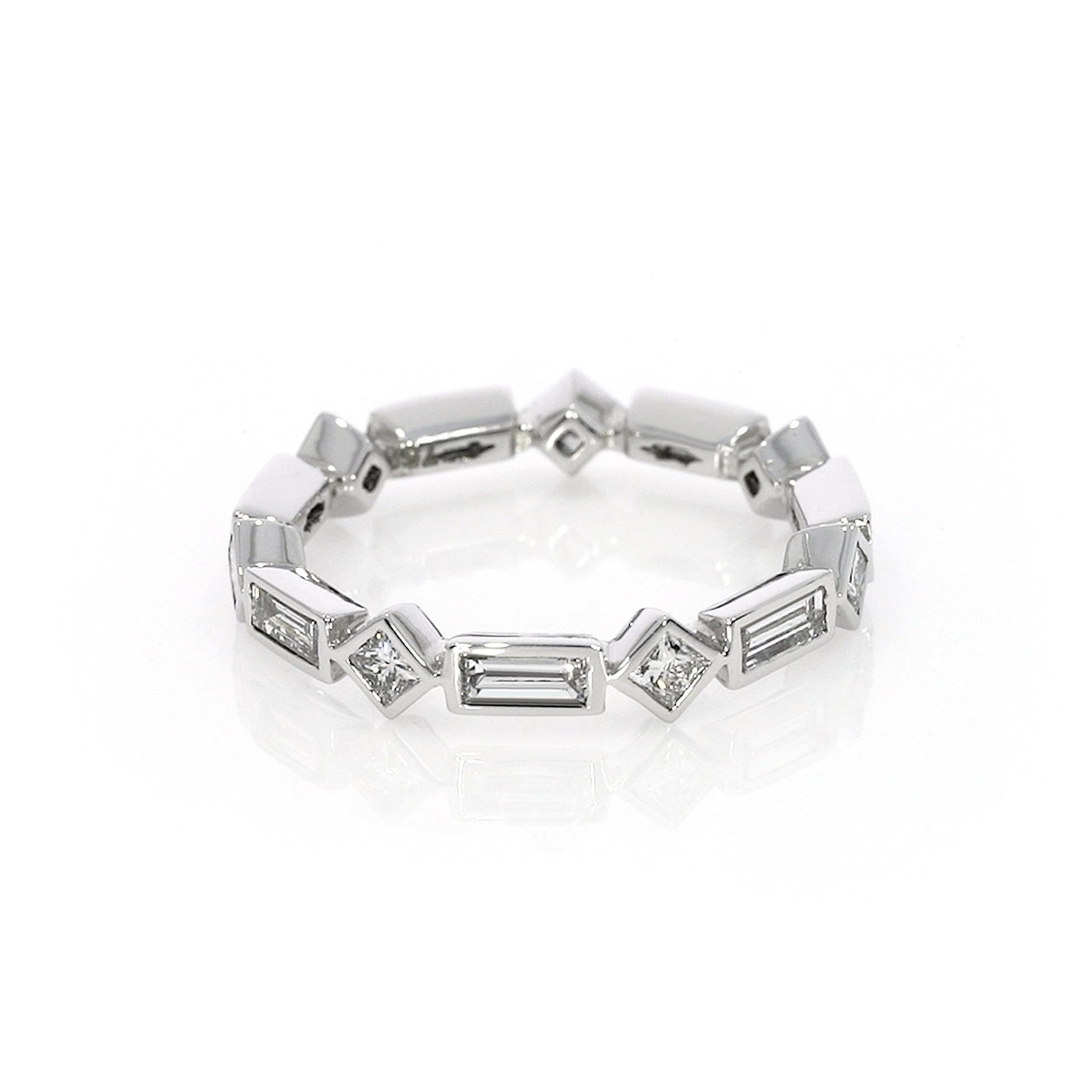 A crisp modern Baguette bezel ring with 1.35cts of princess and baguette cut certified natural diamonds.  
