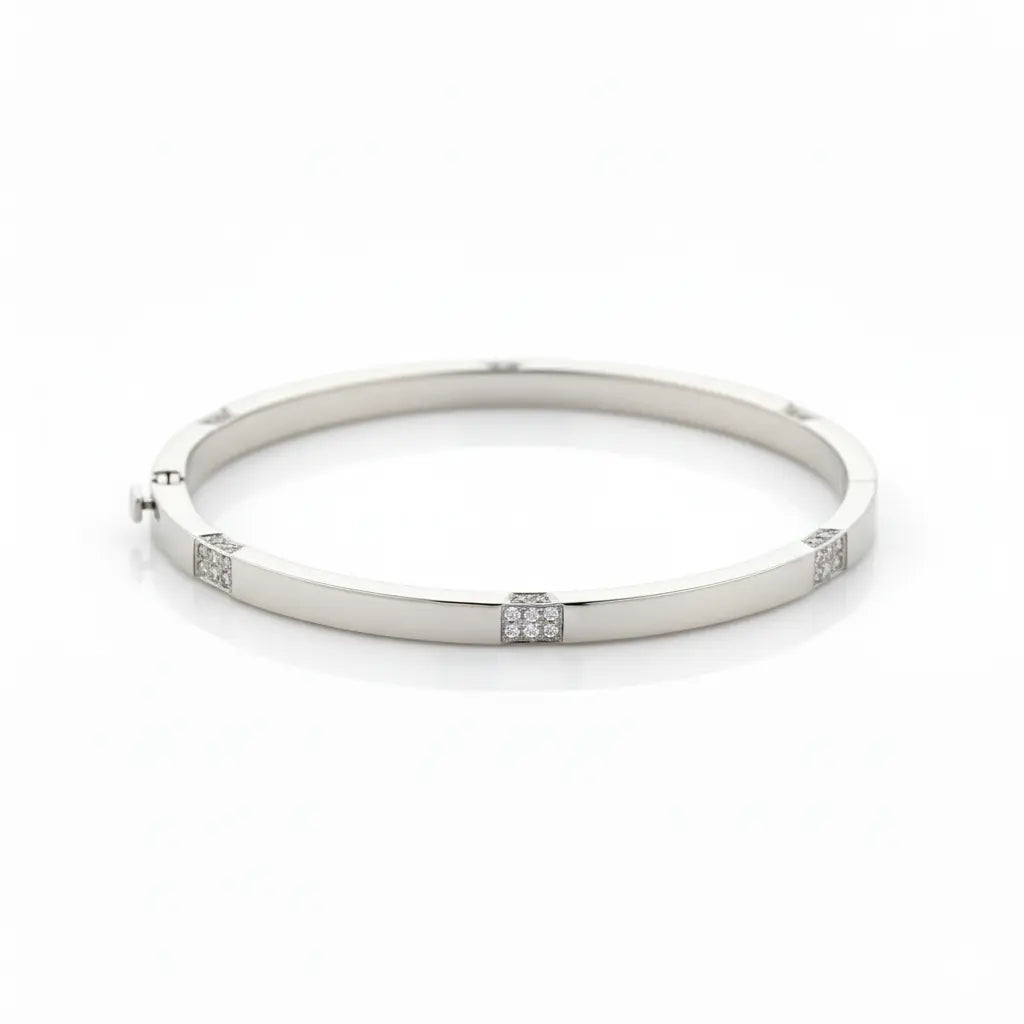 Luxury solid white gold bangle featuring clusters of diamonds for an elegant modern accessory.