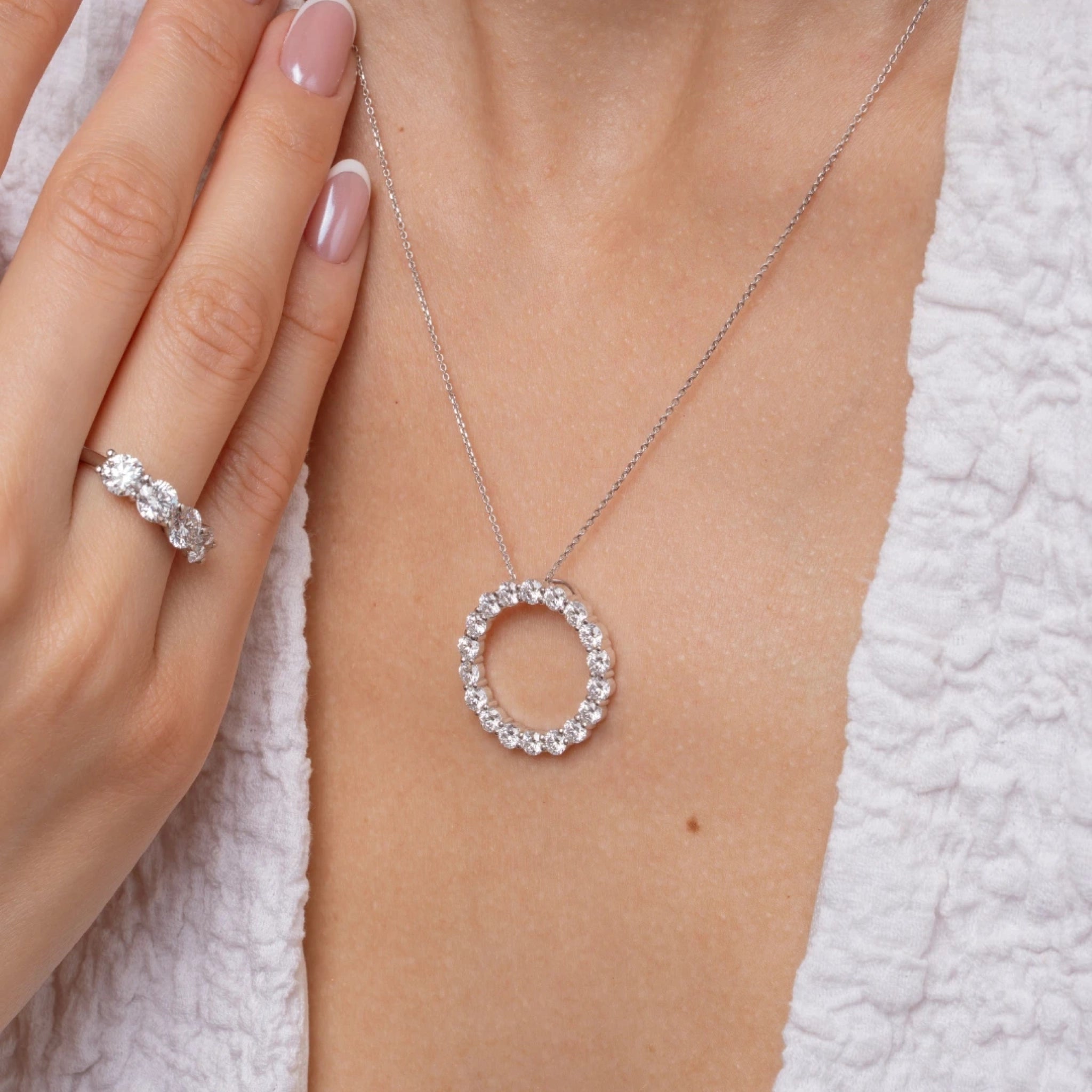 Circle Of Life Necklace - Large worn with a matching ring, featuring sparkling diamonds in a classic round design.