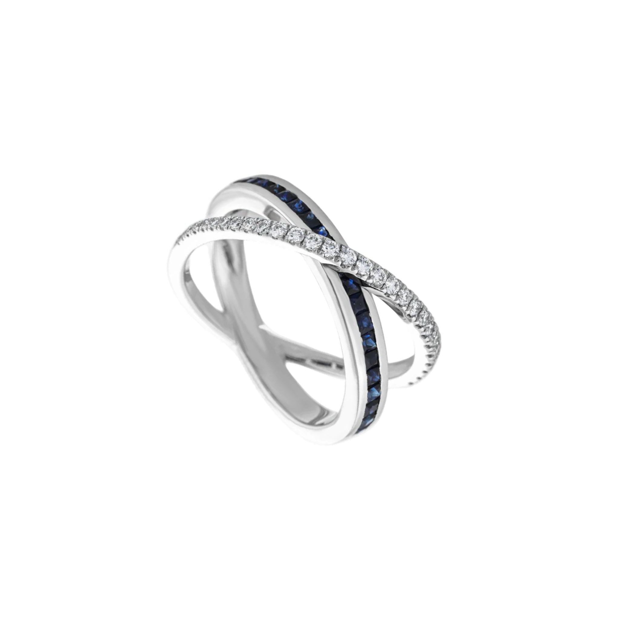 Criss cross ring with an intertwined design, featuring one band set with diamonds and the other with a channel of dark blue sapphires, shown on a plain white background.