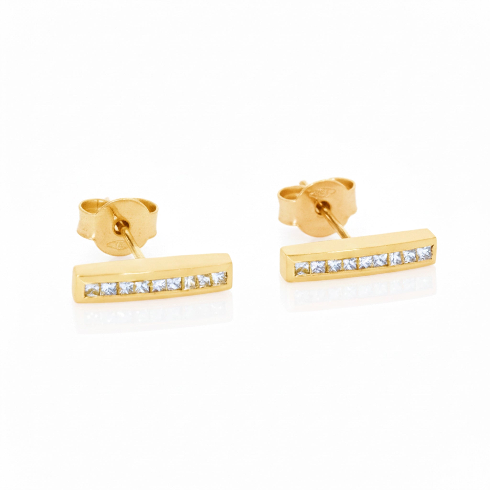 Luxurious certified diamond earrings in gold featuring bar design with sparkling diamonds, perfect for stacking or wearing alone.