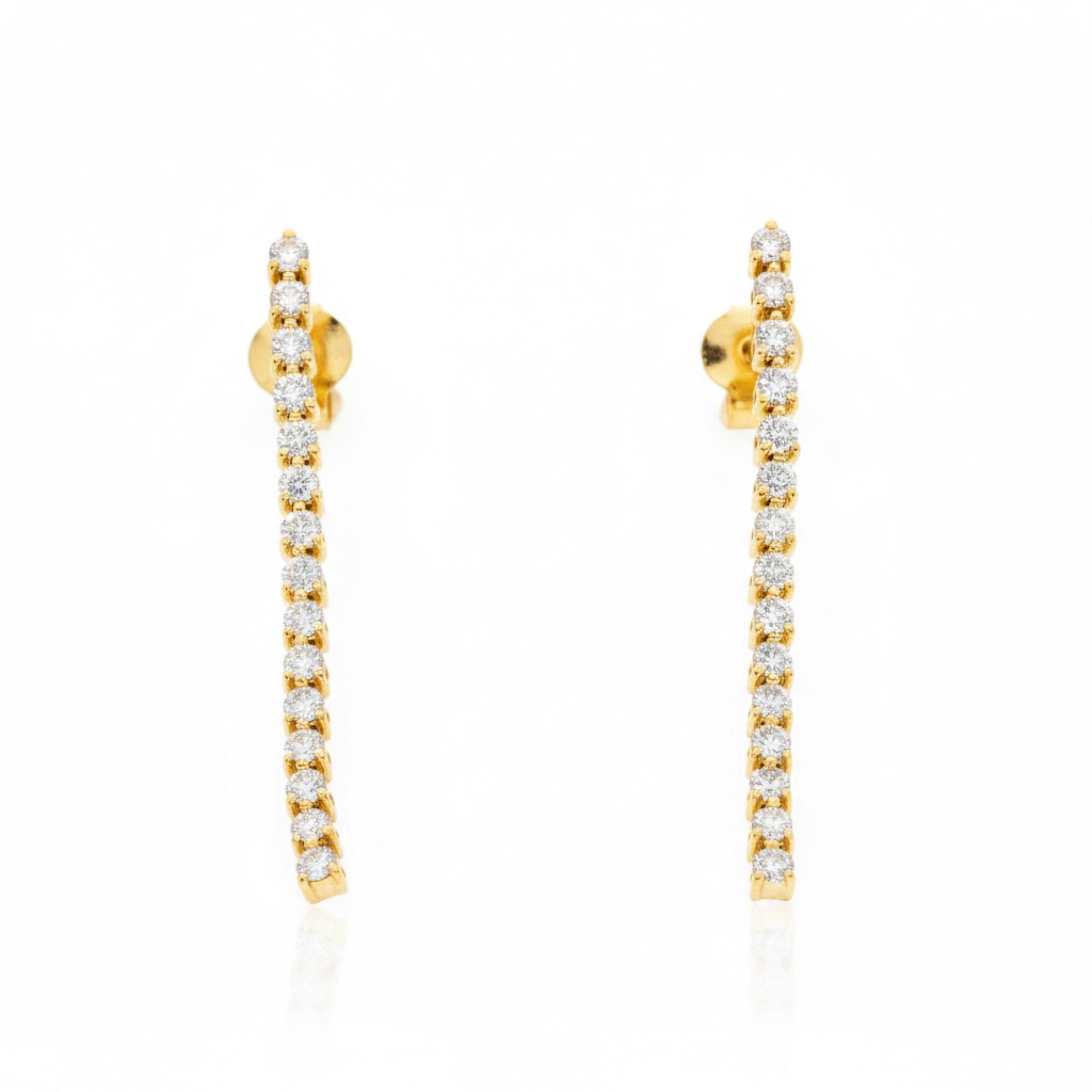 Elegant Diamond Line earrings featuring diamonds set in solid gold, perfect for any occasion.
