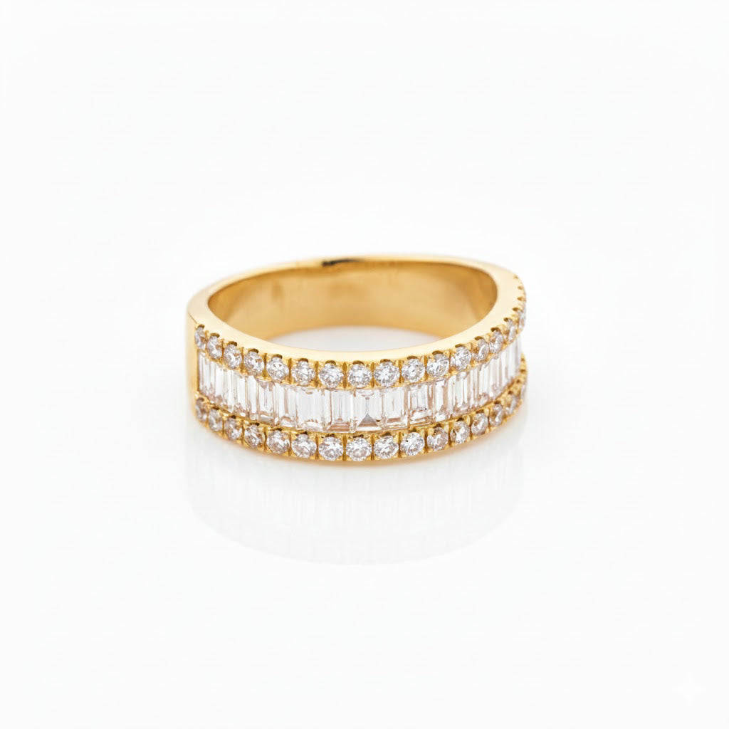 Yellow gold diamond eternity ring with baguette cut diamonds on a white background