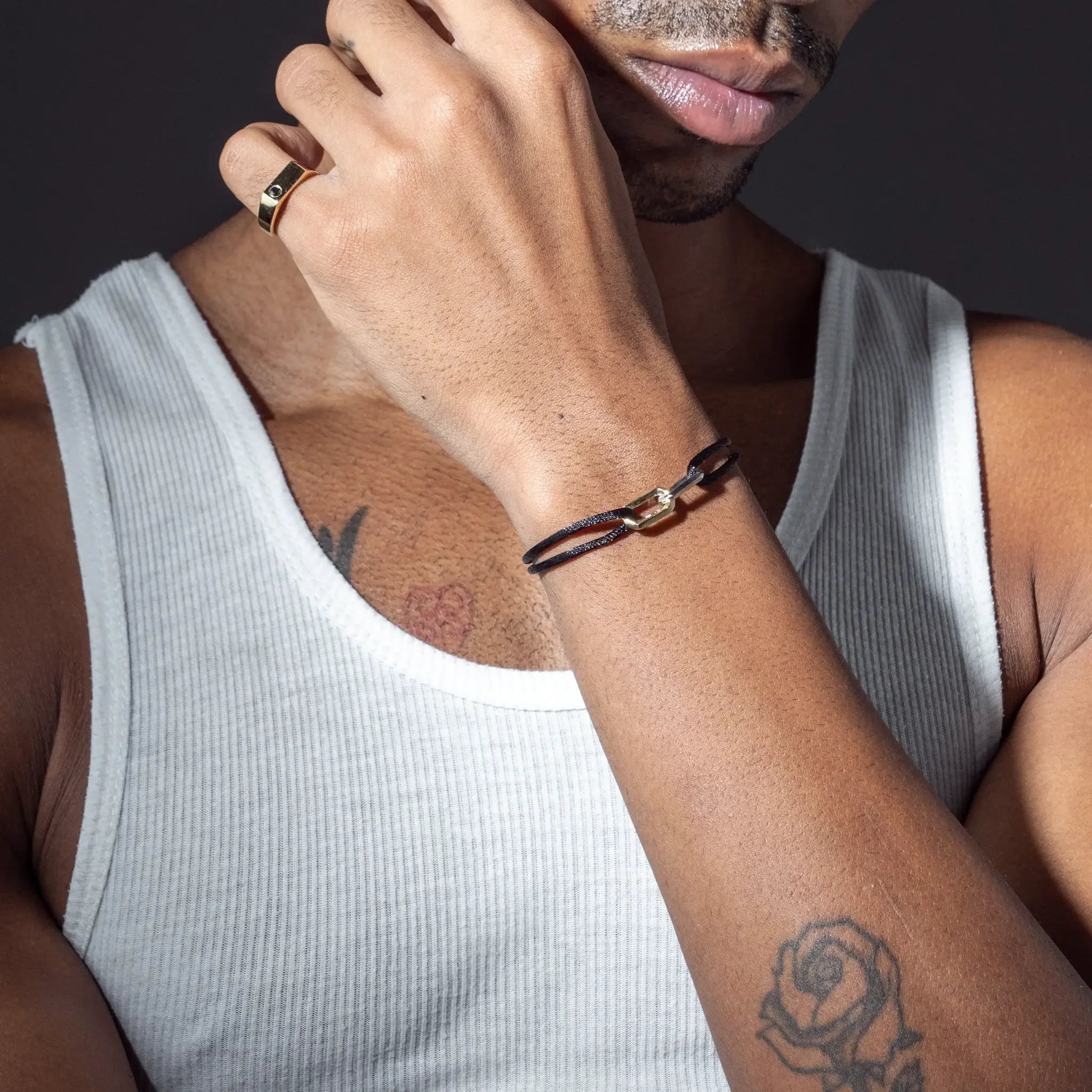 Man wearing personalized bracelet with engraving and gemstones