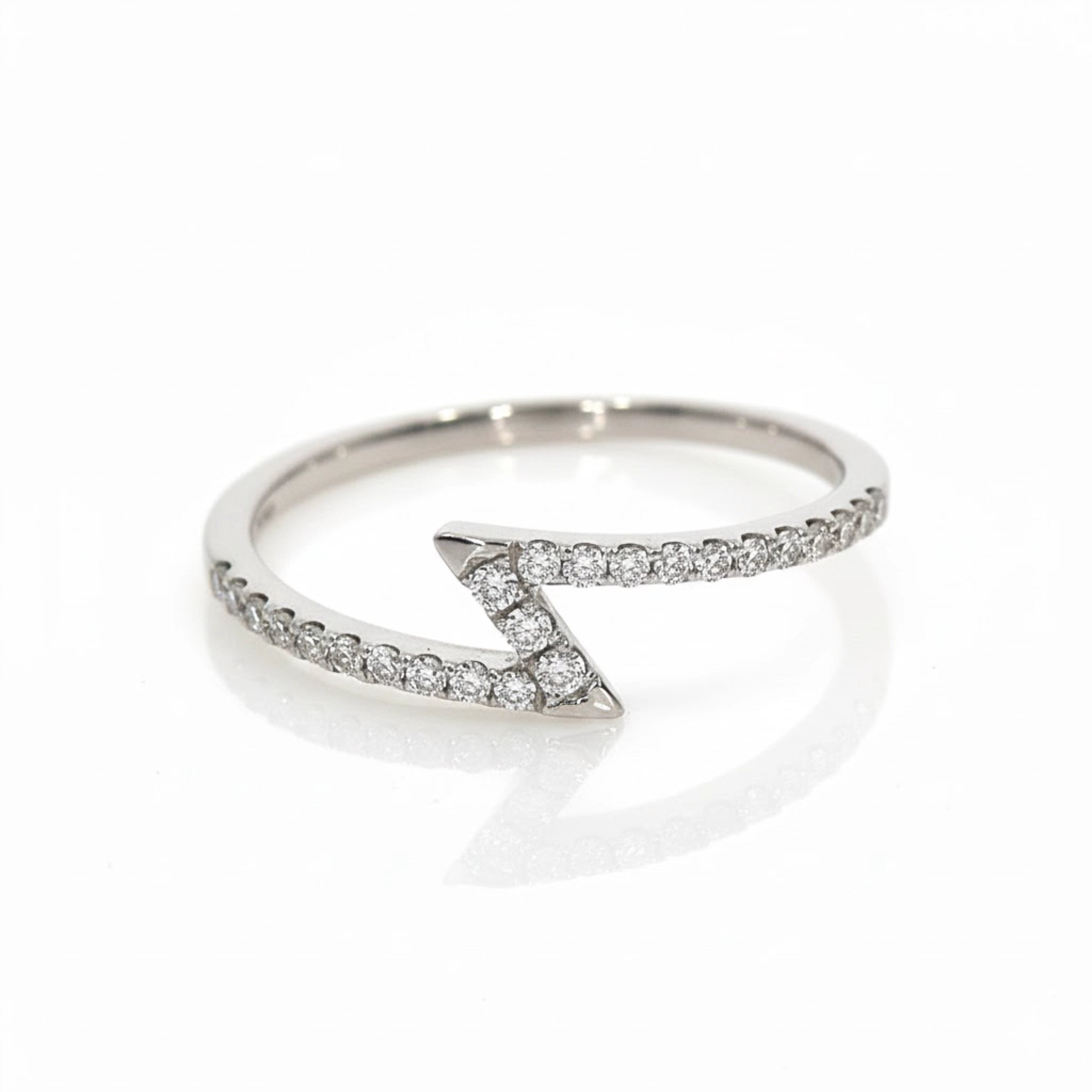 Lightning Bolt Ring featuring diamonds set in elegant gold, symbolizing power and strength.