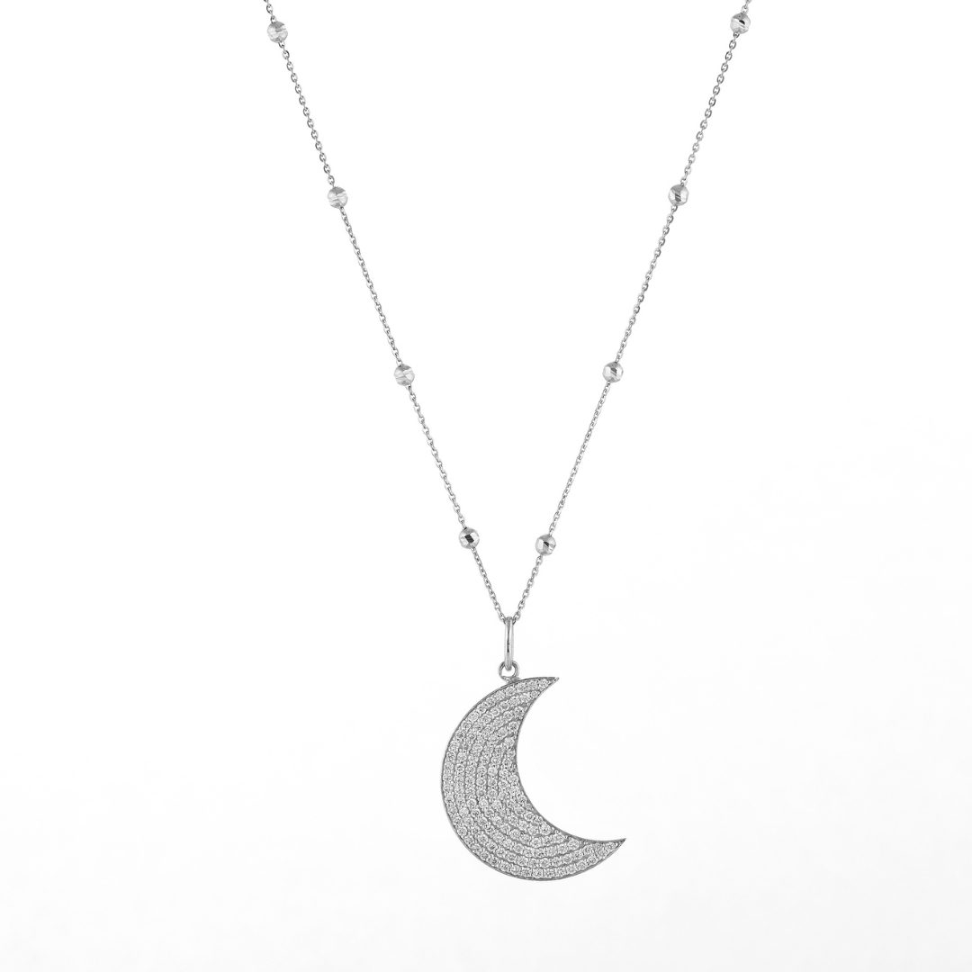 Long Moon necklace featuring diamond accents on an 18ct gold chain for modern elegance.