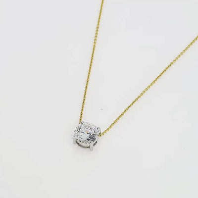 The Floating Diamond Necklace featuring a brilliant cut diamond on an 18ct gold chain, symbolizing elegance and sophistication.