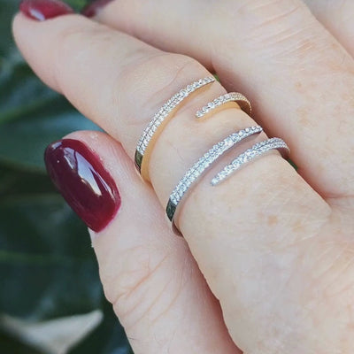 Woman wearing wrap ring with 0.18cts of round brilliant cut diamonds 