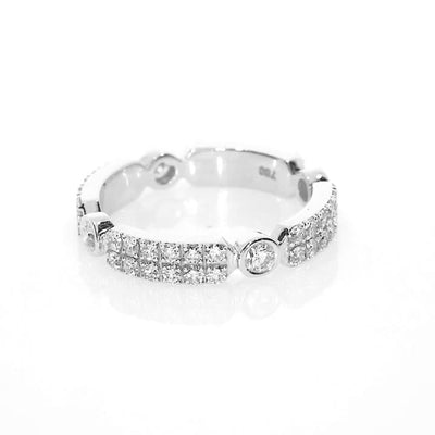 White gold ring featuring bezel-set diamonds on a white background