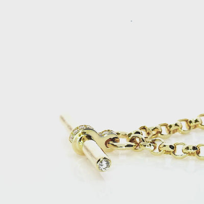 Close-up of T Bar Necklace in yellow gold with diamond accents and pavé detailing.