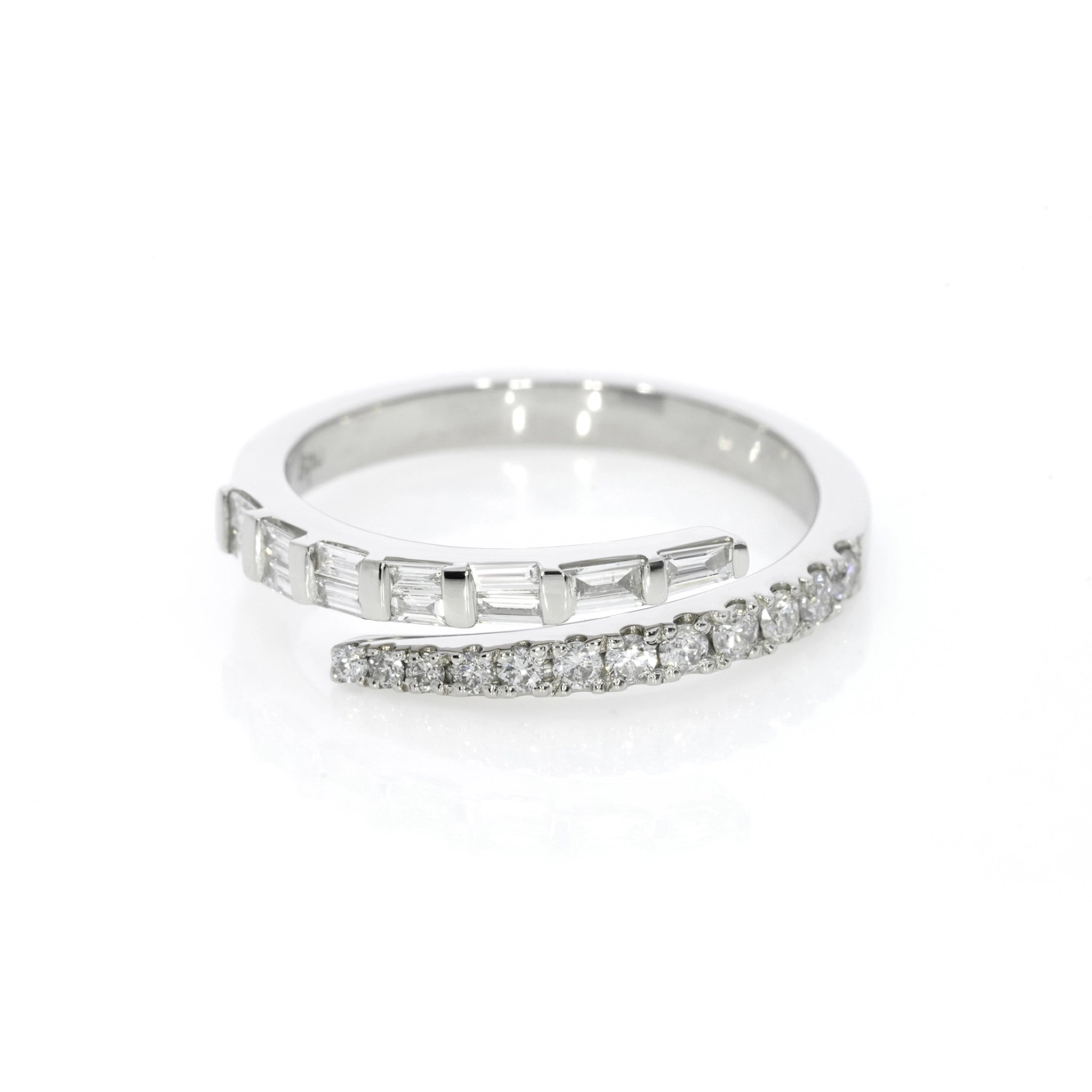 White gold baguette ring with diamonds on a white background