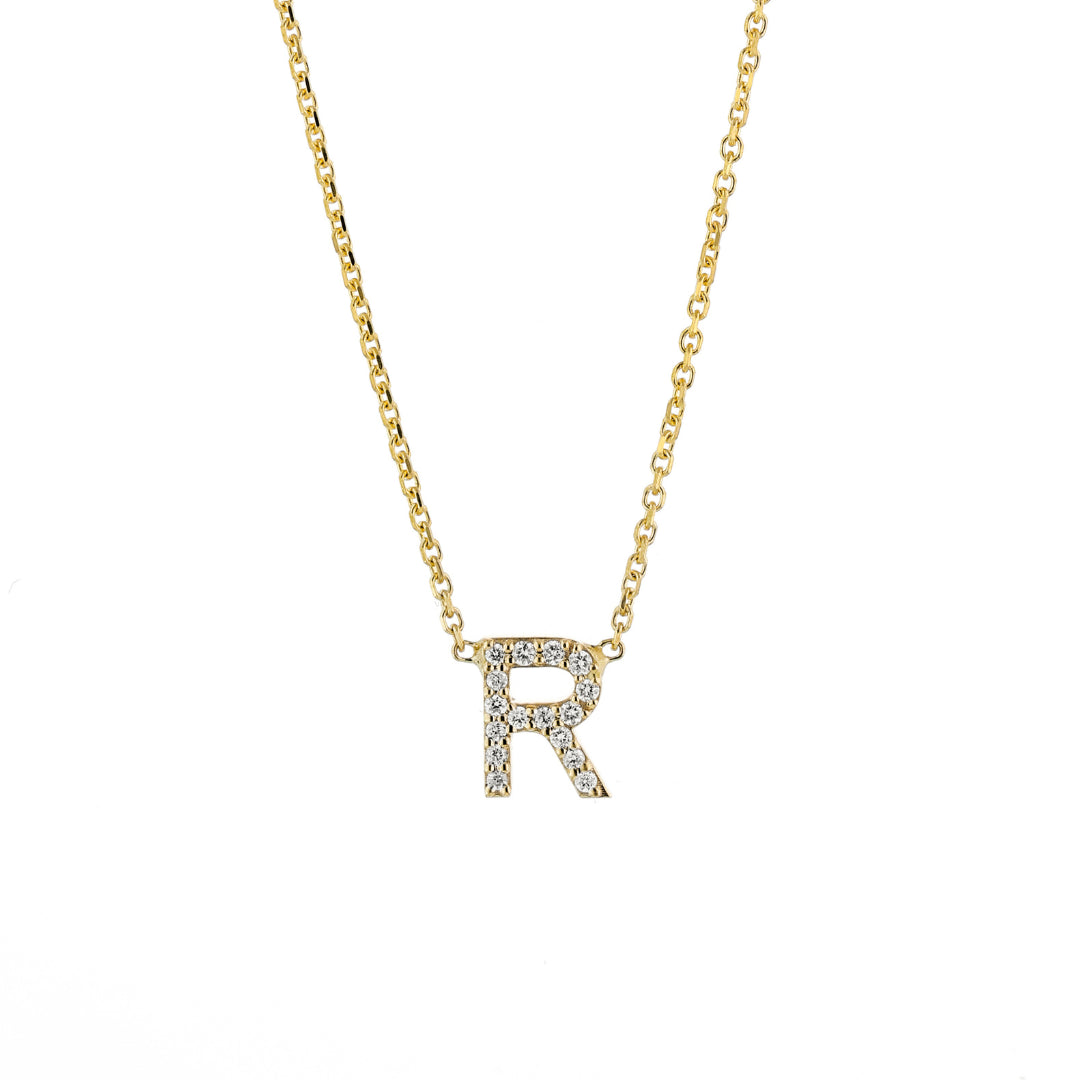 Single diamond necklace with certified diamonds featuring a sparkling letter R pendant in gold.